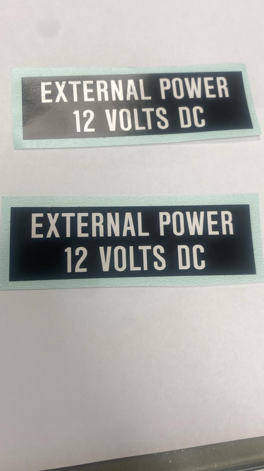 EXTERNAL POWER 12 VOLTS STICKER